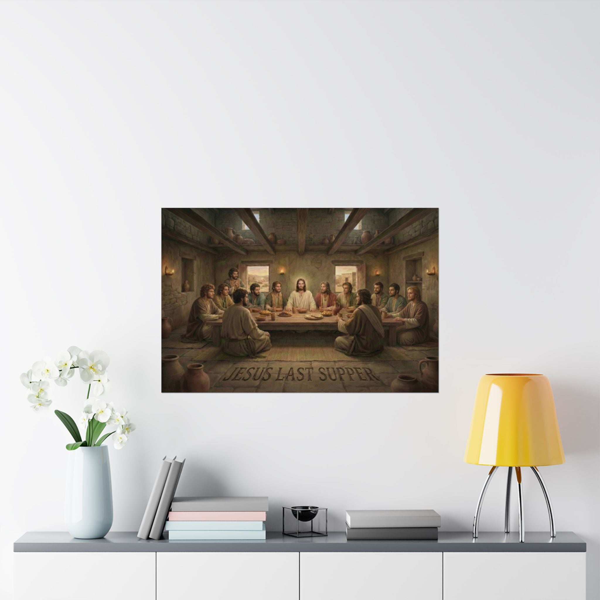 Poster of 'Jesus Last Supper' on a wall above a table with decor items.