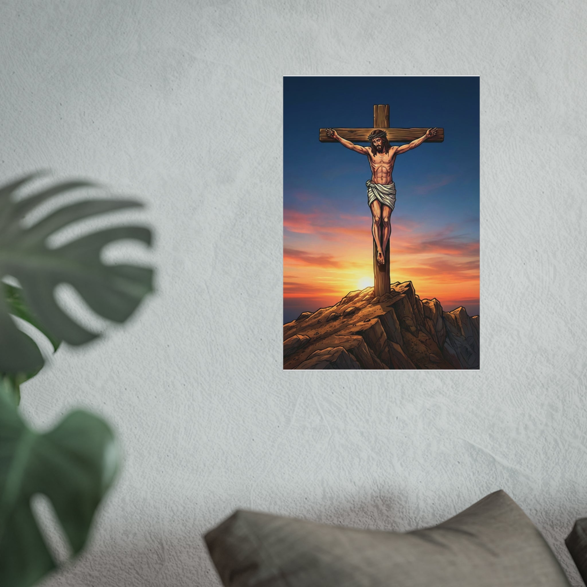 Poster of a crucifixion scene with a sunset background on a wall.